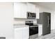 Close up of stainless steel appliances and granite countertops at 289 Limestone Circle, Conyers, GA 30013
