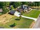 Expansive aerial view of a well-maintained home with lush greenery and a detached garage at 1108 Sequoia Trl, Mcdonough, GA 30252