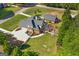 Lush aerial view of a home and separate dwelling with mature trees, pristine landscaping, and white picket fences at 1108 Sequoia Trl, Mcdonough, GA 30252