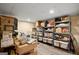 Organized basement storage area with shelving units filled with various items and bins at 1108 Sequoia Trl, Mcdonough, GA 30252