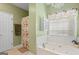 Relaxing bathroom with a soaking tub, shower, and floral accents create a soothing environment at 1108 Sequoia Trl, Mcdonough, GA 30252