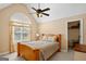 Cozy bedroom with vaulted ceiling, a ceiling fan, and a bright window at 1108 Sequoia Trl, Mcdonough, GA 30252