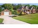 Charming brick home with well-manicured lawn, blooming shrubs, and a welcoming front entrance at 1108 Sequoia Trl, Mcdonough, GA 30252