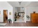 Open foyer featuring hardwood floors and a view into the living room with large arched window at 1108 Sequoia Trl, Mcdonough, GA 30252
