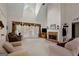 Spacious living room with a fireplace, large windows, and vaulted ceiling at 1108 Sequoia Trl, Mcdonough, GA 30252