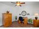 Home office featuring a wooden desk, ceiling fan, and decorative accents at 1108 Sequoia Trl, Mcdonough, GA 30252