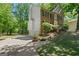 Brick two-story home featuring a three-car garage and lush trees at 9276 Fieldstone Ct, Jonesboro, GA 30236