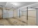 Spacious three-car garage with white doors, concrete flooring, and ample room for storage at 9276 Fieldstone Ct, Jonesboro, GA 30236