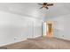 Bright main bedroom with carpeted floors, white doors, and easy access to other rooms in the house at 9276 Fieldstone Ct, Jonesboro, GA 30236
