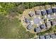 Aerial view of neighborhood featuring homes, mature trees, and cul-de-sac at 1154 Ridge Hollow Ln, Lawrenceville, GA 30043