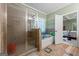 Bathroom with shower and tub combination, as well as tile flooring. Bedroom access at 1154 Ridge Hollow Ln, Lawrenceville, GA 30043