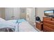 Inviting bedroom with two beds, access to an adjacent room, and bright natural light at 1154 Ridge Hollow Ln, Lawrenceville, GA 30043