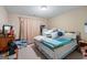 Bedroom featuring cozy decor, carpet floors, and a large window for natural light at 1154 Ridge Hollow Ln, Lawrenceville, GA 30043