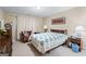 Bedroom featuring cozy decor, carpet floors, and a large window for natural light at 1154 Ridge Hollow Ln, Lawrenceville, GA 30043