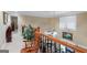Hallway boasts hardwood railings and a view of the fireplace below at 1154 Ridge Hollow Ln, Lawrenceville, GA 30043