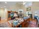 Cozy living room with hardwood floors, vaulted ceilings, fireplace, and natural light at 1154 Ridge Hollow Ln, Lawrenceville, GA 30043