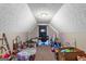 Finished attic space that can be used as storage or an extra room at 1012 Miss Amber Way, Locust Grove, GA 30248