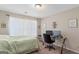 Bedroom with a workspace featuring neutral walls and carpeted floor at 1012 Miss Amber Way, Locust Grove, GA 30248