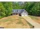 Exterior elevation of a well-maintained house featuring a two-car garage at 1012 Miss Amber Way, Locust Grove, GA 30248