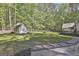 Expansive backyard with in-ground pool, shed, and mature trees at 160 Wills Way, Fayetteville, GA 30214