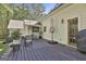 Outdoor deck featuring outdoor furniture and lush greenery at 160 Wills Way, Fayetteville, GA 30214