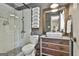 Charming bathroom with tiled shower, vessel sink, and rustic wood vanity at 160 Wills Way, Fayetteville, GA 30214
