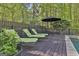 Outdoor deck with patio furniture and lounge chairs by the pool at 160 Wills Way, Fayetteville, GA 30214