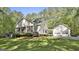 Inviting home with a screened porch, two-car garage, and beautiful lawn at 160 Wills Way, Fayetteville, GA 30214