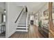Bright foyer with wood-look floors and a staircase leading to the upper level at 160 Wills Way, Fayetteville, GA 30214