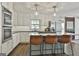 Kitchen featuring stainless steel appliances, white cabinets, and a breakfast bar at 160 Wills Way, Fayetteville, GA 30214