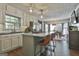 Bright eat-in kitchen featuring a center island with seating and stainless steel appliances at 160 Wills Way, Fayetteville, GA 30214