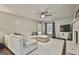 Spacious living room with fireplace, plush sectional sofa, and TV at 160 Wills Way, Fayetteville, GA 30214