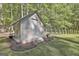 Well-maintained shed with steps and landscaping at 160 Wills Way, Fayetteville, GA 30214