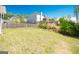Expansive backyard with healthy grass and a perimeter of trees and wooden fence at 44 Mediterranean Ave, Sharpsburg, GA 30277