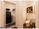 Bright bathroom and laundry area with shelving, modern toilet and sleek fixtures at 44 Mediterranean Ave, Sharpsburg, GA 30277