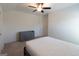 Bedroom with carpet flooring, ceiling fan and a gray dresser at 44 Mediterranean Ave, Sharpsburg, GA 30277
