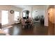Open dining room area with hardwood floors and a view into the adjacent living spaces at 44 Mediterranean Ave, Sharpsburg, GA 30277