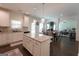Bright kitchen with stainless steel appliances, granite countertops and an island with seating at 44 Mediterranean Ave, Sharpsburg, GA 30277