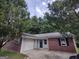 Charming single-story home featuring a brick facade, well-maintained lawn, and attached garage at 2039 Faith Cv, College Park, GA 30349