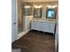 Modern bathroom with dual sinks, marble countertop, glass shower, and tile flooring at 5949 Tyree Rd, Winston, GA 30187