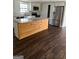 Bright kitchen features stainless steel appliances, tile backsplash, granite countertops and wooden island at 5949 Tyree Rd, Winston, GA 30187