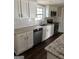 Modern kitchen featuring granite countertops, white cabinets, and stainless steel appliances at 5949 Tyree Rd, Winston, GA 30187