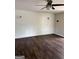 Spacious living room featuring wood floors and a shiplap wall at 5949 Tyree Rd, Winston, GA 30187