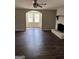 Spacious living room with wood floors and a charming fireplace feature at 5949 Tyree Rd, Winston, GA 30187
