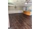 Open-concept living space with wood floors and a kitchen island at 5949 Tyree Rd, Winston, GA 30187