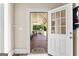 Back porch with outdoor seating, view of backyard, and access to the interior at 2354 Hamilton St, Hampton, GA 30228