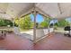 Covered porch features a grill, table and seating and view of the yard at 2354 Hamilton St, Hampton, GA 30228