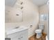 Bathroom features a toilet, vanity sink, framed mirror and shower stall at 2354 Hamilton St, Hampton, GA 30228