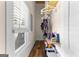 Walk-in closet with shelving, hanging rods, and natural light from a window at 2354 Hamilton St, Hampton, GA 30228