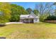 Charming home with inviting front porch set on a spacious lot with mature trees at 2354 Hamilton St, Hampton, GA 30228